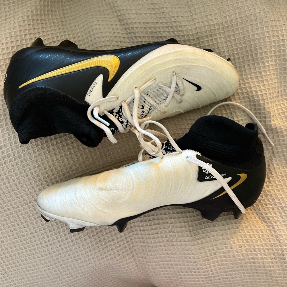 Nike Black and Cream Cleats with Gold Accent